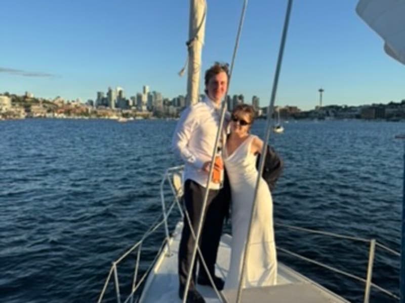 Wedding couple on the bow with Seattle skyline
