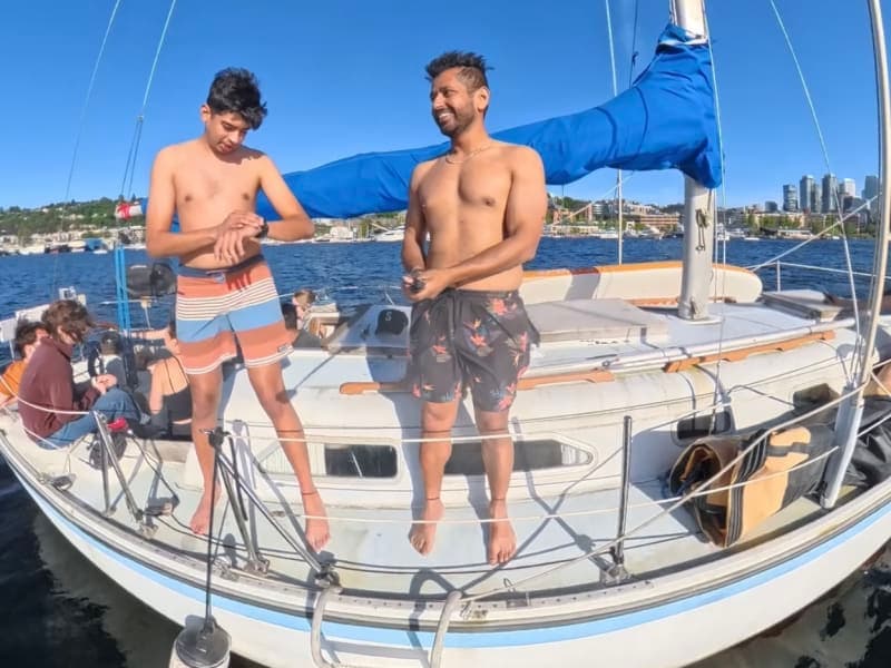 Guests relaxing on the bow during a day charter